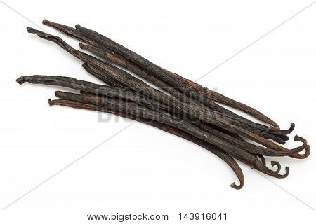 Organic dry sticks of Vanilla (Vanilla planifolia) isolated on white background. Macro close up. Front view.
