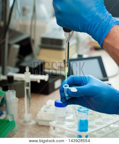 Scientist filling test tube science lab