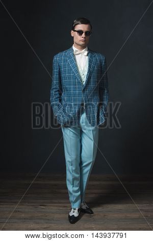 Sharp Dressed Young Man In Retro 1920S Style. Wearing Sunglasses.