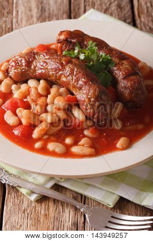 Pork Sausages With Beans And Cooked Tomatoes On A Plate Close-up. Vertical