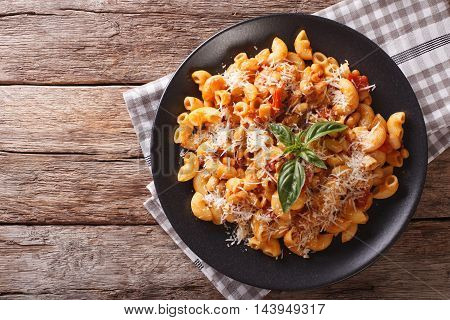 Gomiti Pasta With White Beans And Cheese On A Plate Close-up. Horizontal Top View