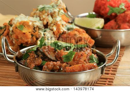 asian food aubergine curry bainghan bharta with coriander garnish