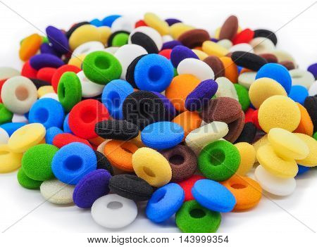 Colorful of earbuds tips on white background, Selective focus