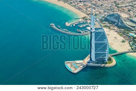 DUBAI, UAE - MARCH 2018: Aerial view of Burj Al Arab hotel in Dubai, one of the most luxury hotel in the world.