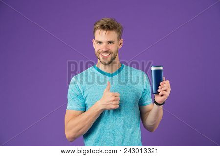 Happy Man Show Thumbs Up With Gel Bottle On Violet Background. Bearded Man Like Shampoo Tube On Purp