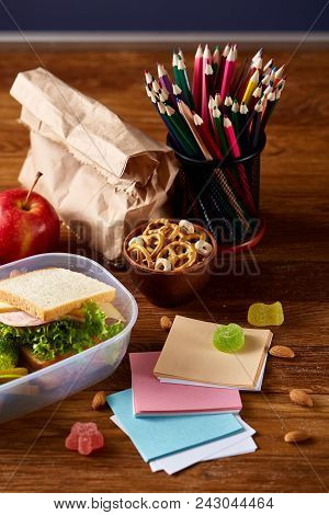 Preparing Ham And Cheese Sandwiches For School Lunchbox On Wooden Background, Close Up. Healthy Eati