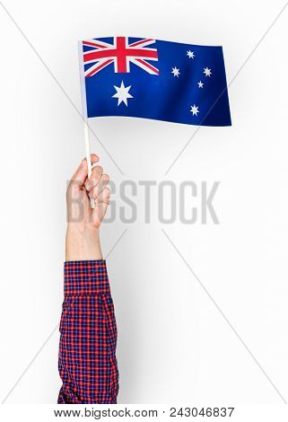 Person waving the flag of Commonwealth of Australia