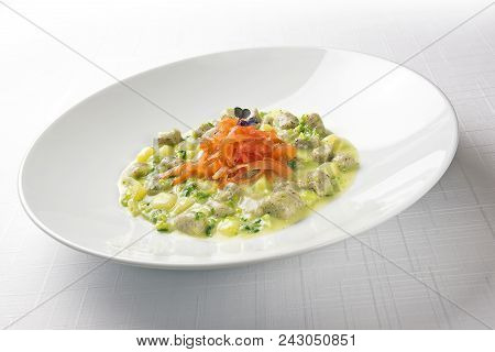 Plate With Buckwheat Dumplings With Cream Of Potato Broccoli And Salmonid Trout
