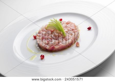 Isolated Fish Plate With Amberjack Tartare With Mustard Jam And Pomegranate Grains