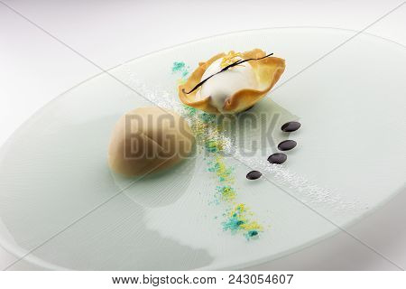Portion Of Dessert With Glazed Cassata Half Sphere And Ice Cream