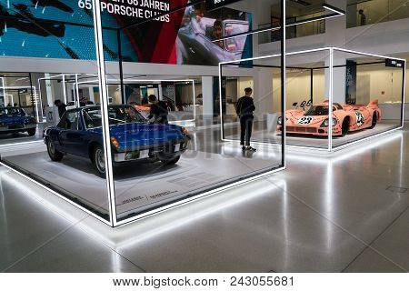 Berlin, Germany - May 15 2018: People Looking At Porsche Sports Cars Standing At Volkswagen Group Fo