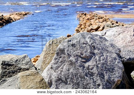 Sandy Beach, Pieces Of Dried Cane, Stone Wall
