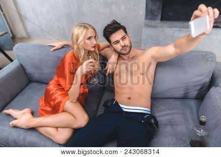 Young Lovers Make Selfie At Home Party. Party Concept