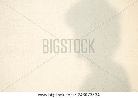 Shadow Of Human Head On Abstract Wall