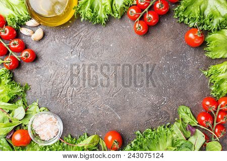 Green Salad Frame On Dark Stobe Background, Top View With Copy Space. Spring Mix. Fresh Green Salad.