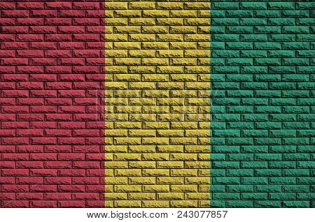 Guinea Flag Is Painted Onto An Old Brick Wall