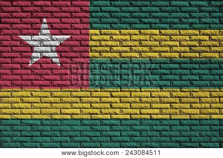 Togo Flag Is Painted Onto An Old Brick Wall