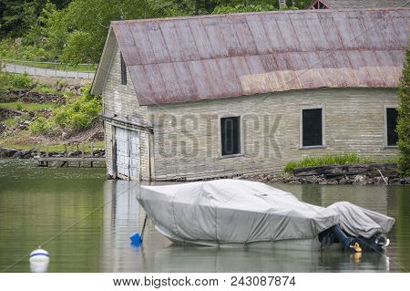 Lake Willoughby, Westmore, Vermont, Usa - June 11, 2010: Old Boathouse Sagging Into Lake Willoughby