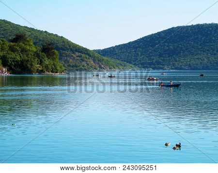 Abrau-durso - May 5, 2018: People On Boats Swim On Lake Abrau On A Warm Spring Day. Abrau-durso, Kra