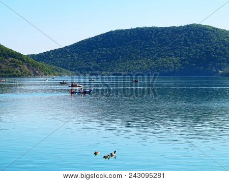 Abrau-durso - May 5, 2018: People On Boats Swim On Lake Abrau On A Warm Spring Day. Abrau-durso, Kra