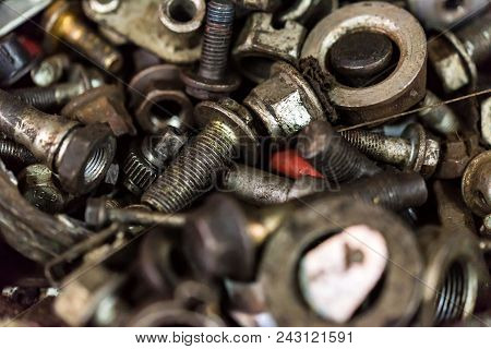 Close-up Used Rusty Steel Bolts Background. Car Details. Industrail Abstract Concept