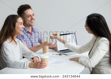 Excited Millennial Couple Get Keys Become First Time Home Owners Make New House Purchase Deal With R
