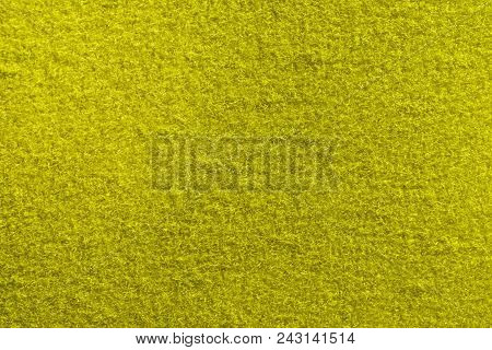 Yellow Fleecy Material Texture. Detailed Fibers Fluffy Surface Background.