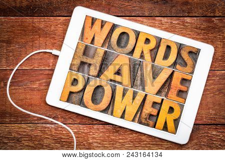 words have power message in vintage letterpress wood type on a digital tablet