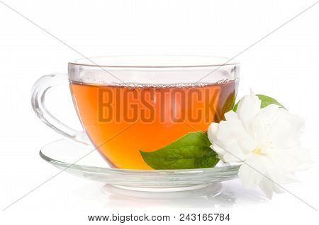 Glass Cup Of Tea With Jasmine Flowers And Leaves Isolated On White Background