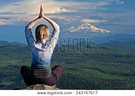 Mindfulness And Inner Peace. Woman Meditating By The View Of Volcano Mount Hood In Oregon. The Dalle
