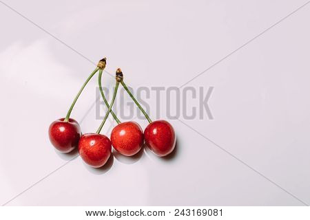Fresh Cherry On Plate On Wooden Blue Background. Fresh Ripe Cherries. Sweet Cherries. Close Up