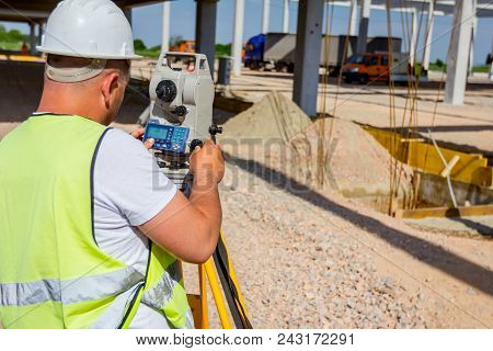 Surveyor Engineer Is Measuring Level On Construction Site. Surveyors Ensure Precise Measurements Bef