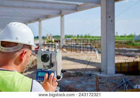 Surveyor Engineer Is Measuring Level On Construction Site. Surveyors Ensure Precise Measurements Bef