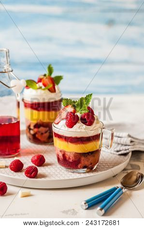 Fruit Cake, Jelly, Custard, Berry And White Cocolate Whipped Cream Individual Trifles, Copy Space Fo