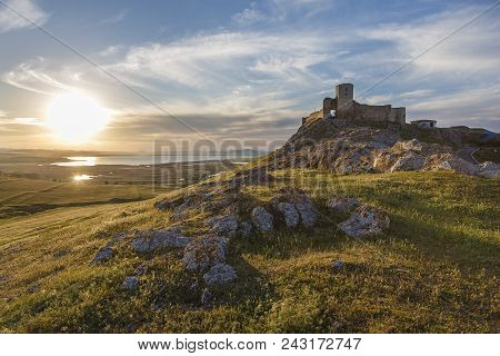 Beautiful Landscape And A Sunset Sky Over Enisala Old Stronghold Citadel, Dobrogea, Romania
