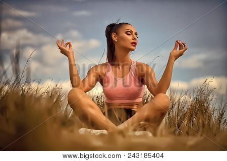 Sensual Sexy Woman. One Sexual Young Brunette Woman With Straight Beautiful Body In Sportswear Sitti