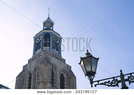 Tower Of Gertrudiskerk With Weathercock In Holland. Blue Sky,