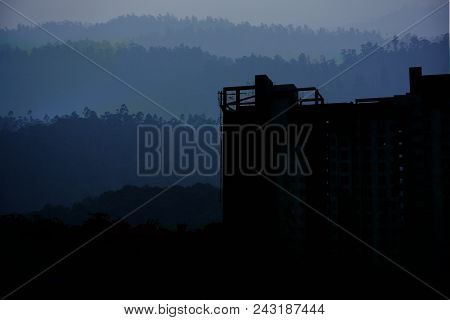 Double Exposure Of Development And Mountain Range