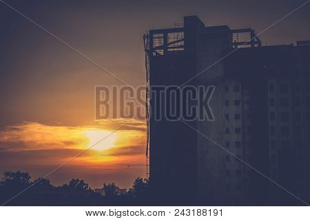 Silhouette Of Construction Site At Sunset- Cityscape