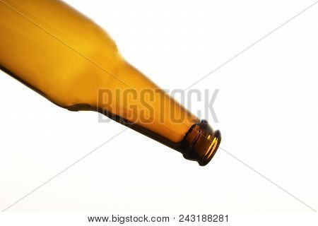Empty Yellow Beer Bottle On Isolated Background
