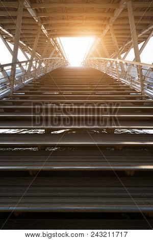 Stairs Of Solferino Pedestrian Bridge Over River Seine Against Sun In Paris, France