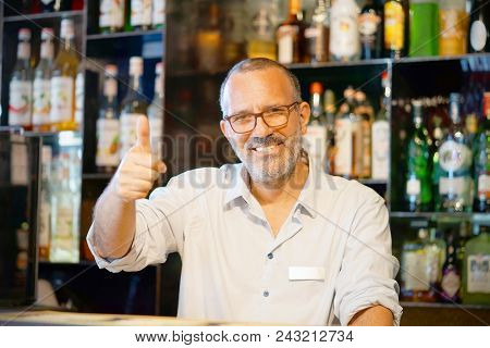 Professional Bartender Arm Show Ok In Workplace Closeup. High Level And Quality Service. The Concept