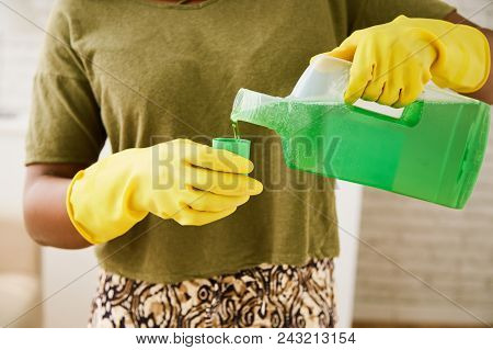 Housewife Measuring Right Ammount Of Laudry Detergent