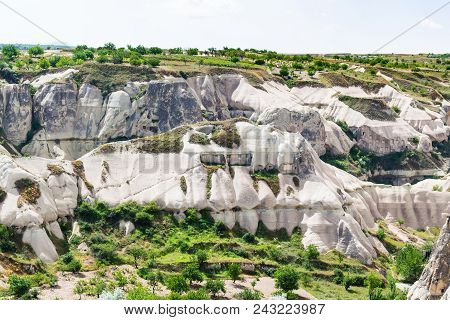 Travel To Turkey - Rock-cut Houses On Mountaion Slope In Goreme National Park In Cappadocia In Sprin