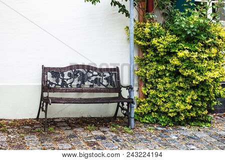 Travel To Germany - Wet Old Bench In Residential Quarter On Kirchgasse Street In Augsburg City In Ra