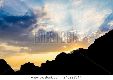 Amazing Landscape Of Mountain Sunset. Rays Of The Sun Against The Sky With Colorful Clouds. Contrast