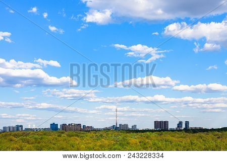 Blue Sky With White Clouds Over Residential District And Green Forest Of Timiryazevsky Park In Mosco