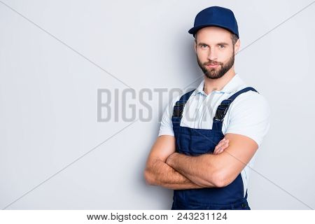 Portrait With Copy Space, Empty Place For Advertisement Of Muscular Half Turned Deliver In Blue Unif