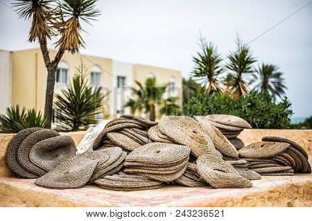 Round Wicker Seats In An Ancient Amphitheater With Clay Stepsin An Arab Town