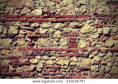 Wall Of Stones And Red Bricks With Lime And Cement With Vintage Effect